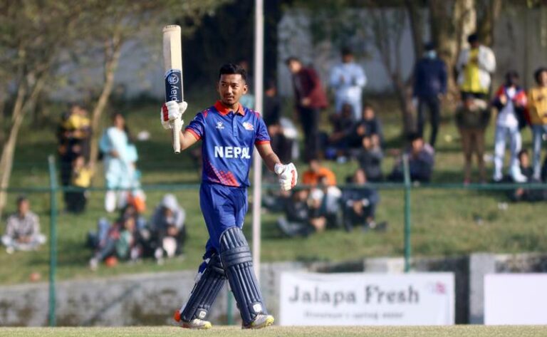 Arjun Saud celebrates a half century in match between Nepal and the UAE at TU Cricket Stadium on on November 14, 2022. Photo by : Subas Humagain/The National