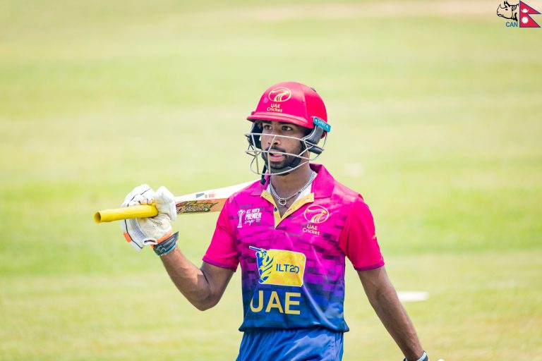 Vriitya Aravind walks back to the pavilion
