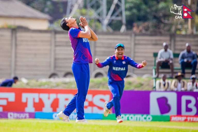 Kishore Mahato looks up after picking up a wicket