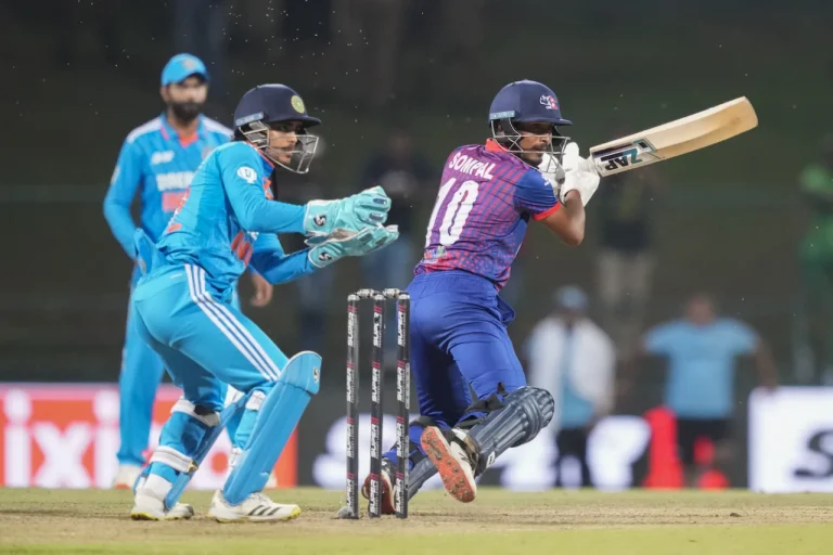 Sompal Kami plays a shot against India