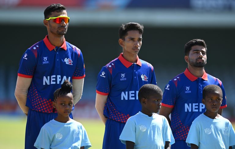 EAST LONDON, SOUTH AFRICA - JANUARY 21: Dev Khanal of Nepal (L) lines up for the National Anthems ahead of the ICC U19 Men's Cricket World Cup South Africa 2024 match between New Zealand and Nepal at Buffalo Park on January 21, 2024 in East London, South Africa. (Photo by Johan Rynners-ICC/ICC via Getty Images)