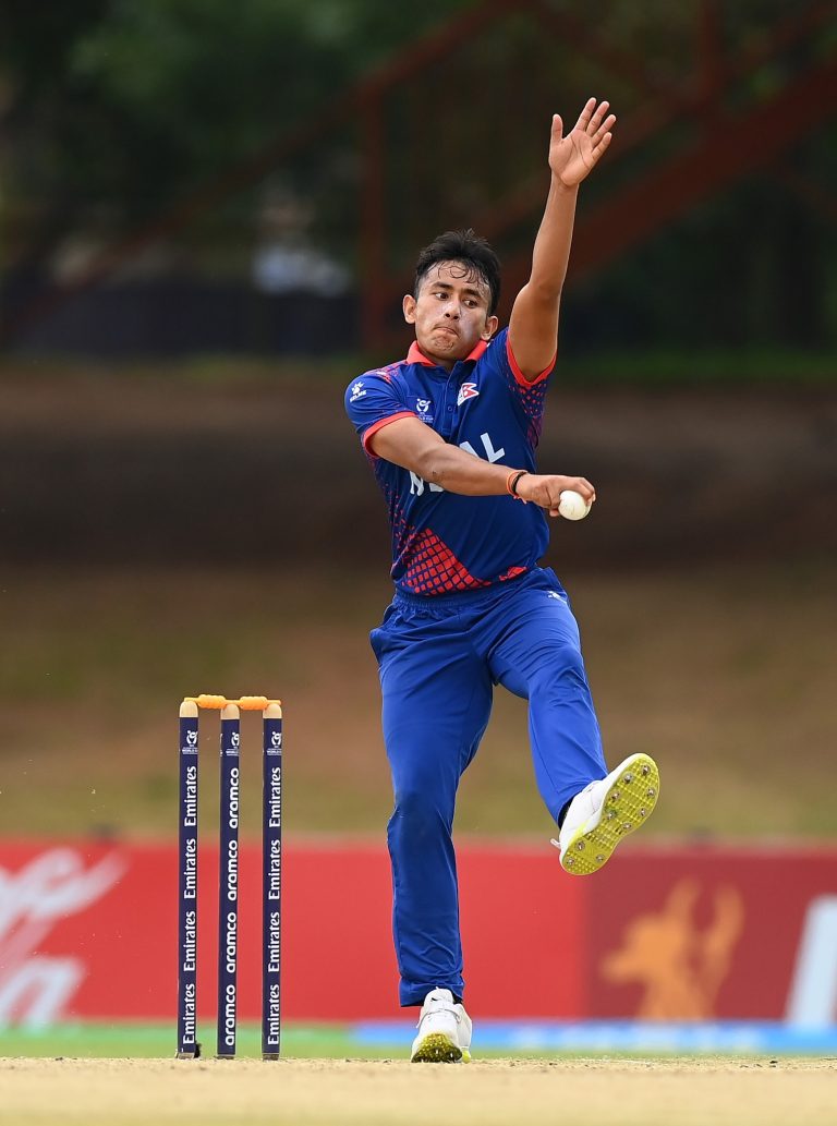 BLOEMFONTEIN, SOUTH AFRICA - FEBRUARY 02: Akash Chand of Nepal in bowling action during the ICC U19 Men's Cricket World Cup South Africa 2024 Super Six match between India and Nepal at Mangaung Oval on February 02, 2024 in Bloemfontein, South Africa. (Photo by Alex Davidson-ICC/ICC via Getty Images)