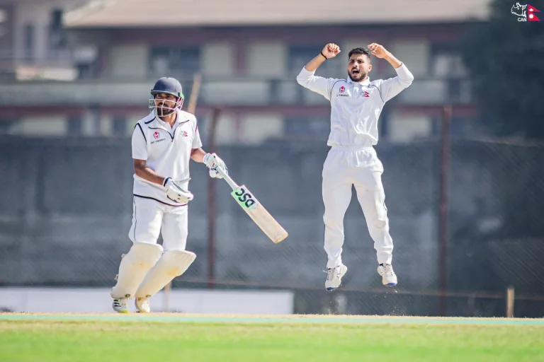 Bhim Sharki flying in ecitement in white jersey