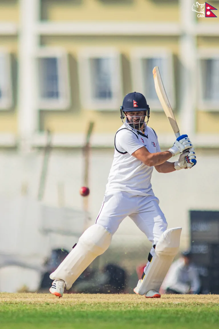 Binod Bhandari bats in white jersey