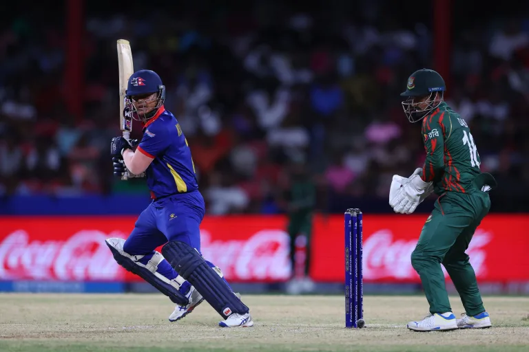 ST VINCENT, SAINT VINCENT AND THE GRENADINES - JUNE 16: Kushal Malla of Nepal bats as Litton Das of Bangladesh keeps during the ICC Men's T20 Cricket World Cup West Indies & USA 2024 match between Bangladesh and Nepal at Arnos Vale Ground on June 16, 2024 in St Vincent, Saint Vincent and The Grenadines. (Photo by Matthew Lewis-ICC/ICC via Getty Images)