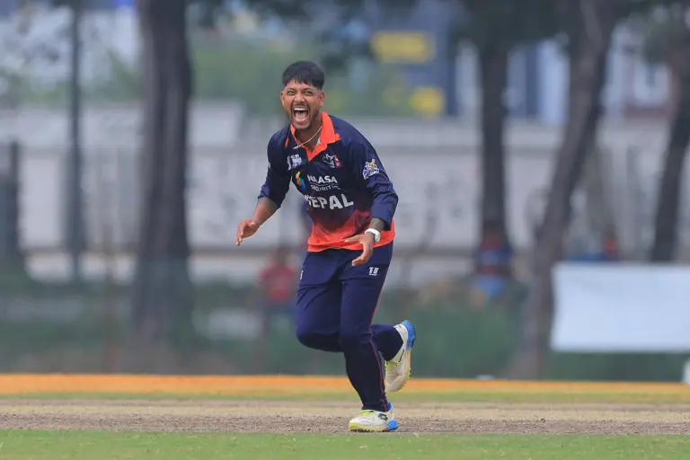 Sandeep Lamichhane celebrates after the wicket. Photo: Peter Lim/ACC